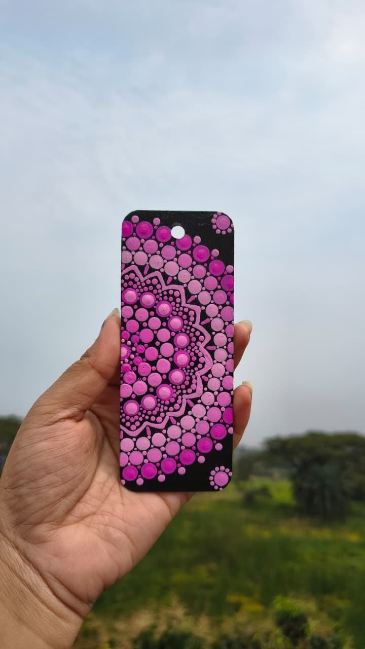 Pink and magenta mandala bookmark on black background